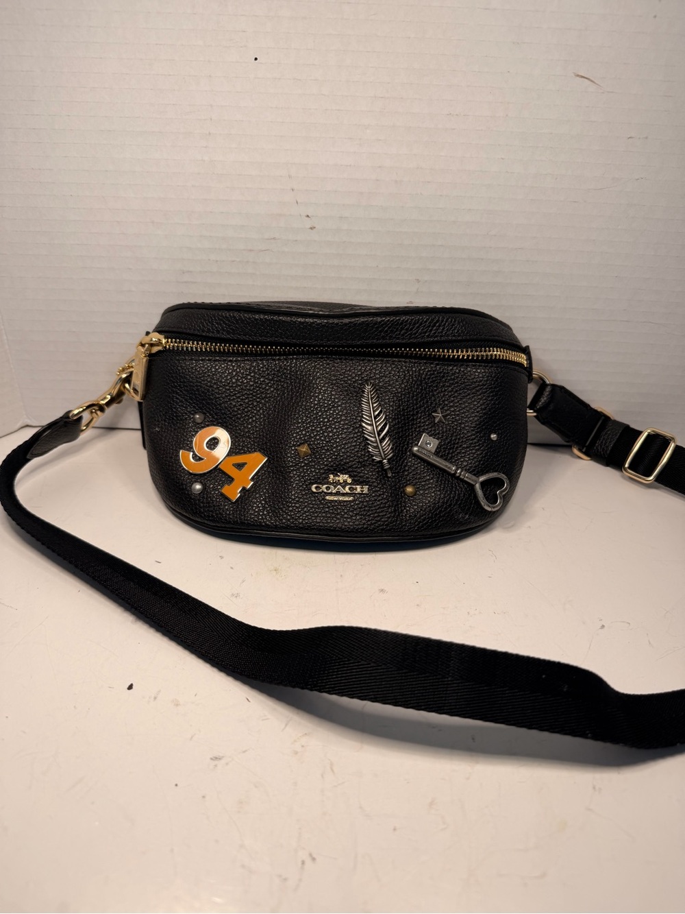 Coach Black Pebbled
Leather Charter Belt Bag with Patches and Charms